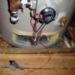 Plumbing (Water Heater) - Housing open, Parts disassembeled, Rusted gas pipe